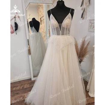 Сверкающее свадебное платье А-силуэта Roycebridal с полупрозрачным лифом с открытой спиной и крошечными блестками, покрывающими свадебное платье из тюля